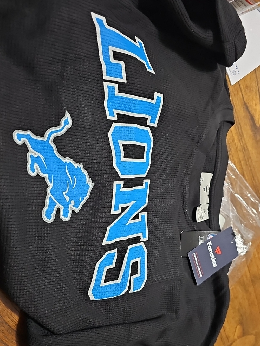 Fanatics Black Thermal Long Sleeve Shirt with Bright Blue Lions Graphic